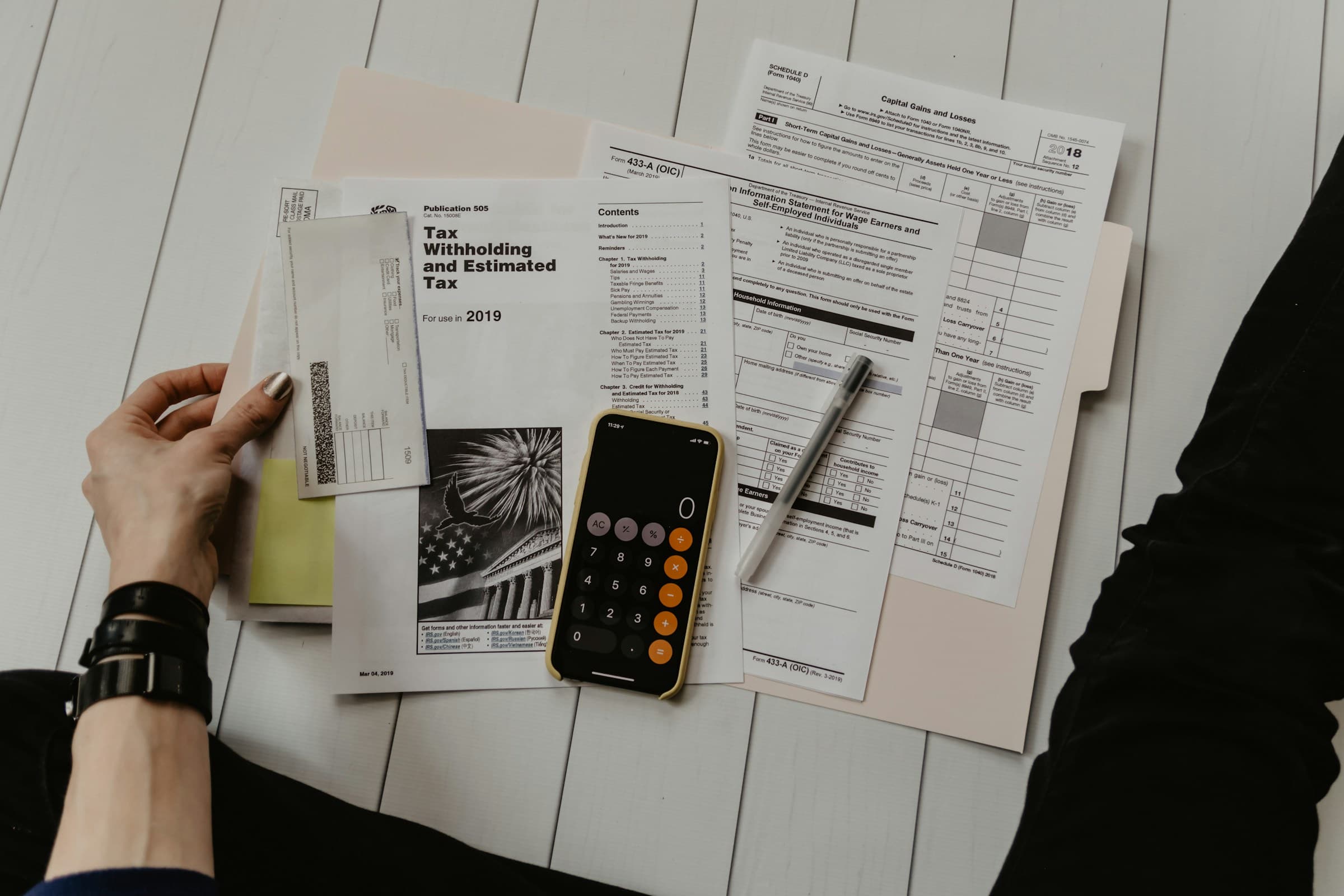 Calculator with financial documents on a desk