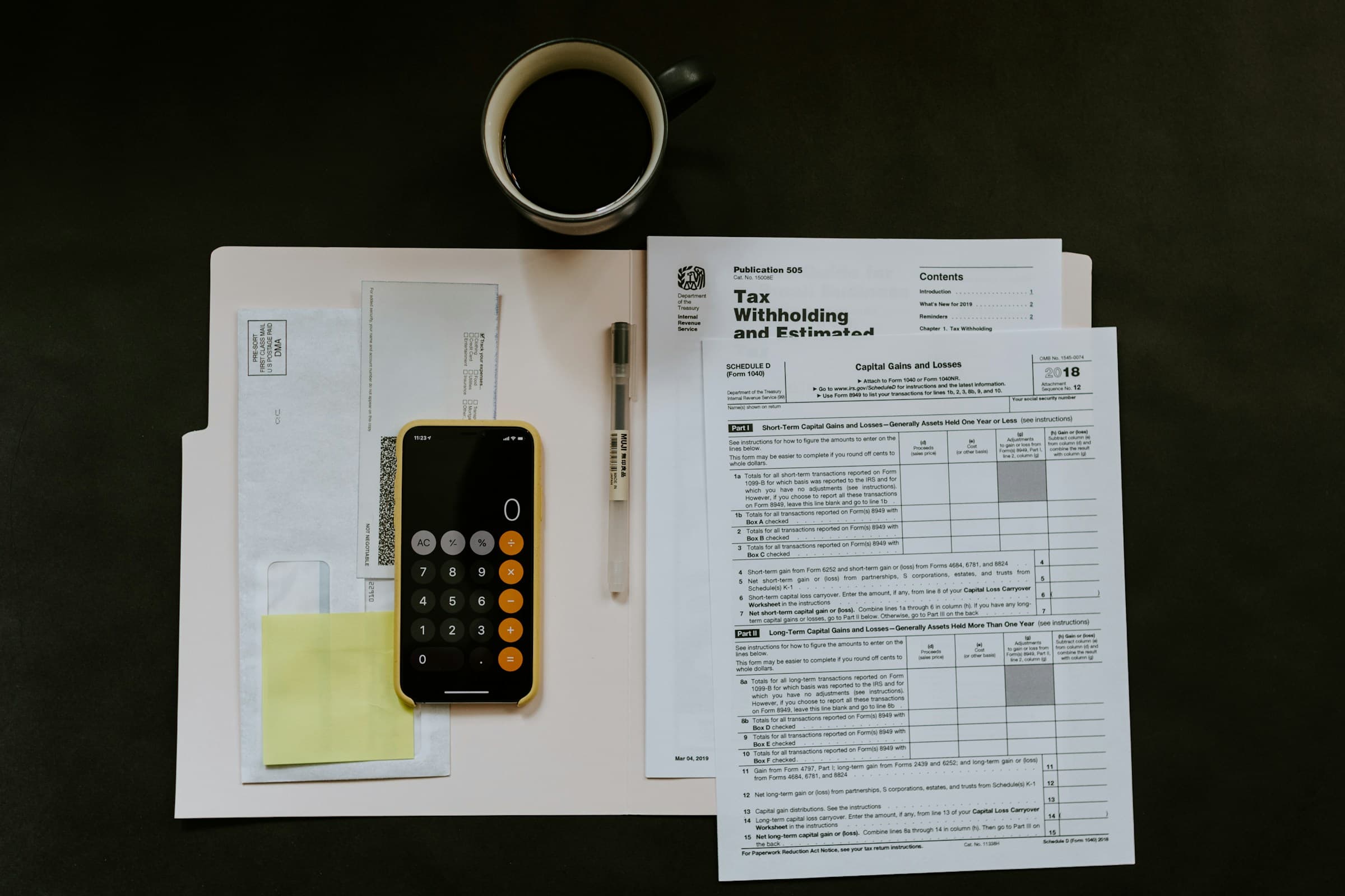 Person reviewing financial documents and budget